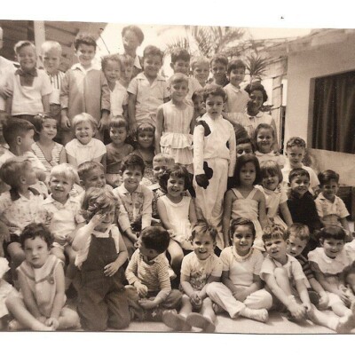 Attached are a few photos from "Mrs. Lenky's Kindergarten."   If I'm not too much mistaken, the kindergarten teacher's real name was Lempke.  However, we kids couldn't pronounce this name, so she was Mrs. "Lenky."  I don't find myself in this photo; maybe I was sick.  First row, 4th from the right, is Tommy Koppel.  Behind him, that may be Sonia Zurita.  In the last row Mrs. Lenky herself and maybe also Niko.