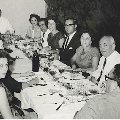 From left front, clockwise around table: Gerda Sifnaghel (nee Gumpel), Edith Koppel (nee Wellisch), Else Wellish, Zurita, ?, ?, Ruth Czarninski, Alfred Czarninski, Ilse Grunewald (nee Koppel), Heinz Grunewald, Magda Koppel (nee Partos), John Koppel , Leo ?, Manea Sifnaghel (back to camera).